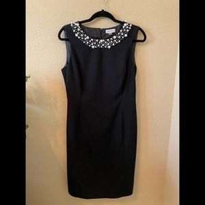 Little black dress with pearl accented neck